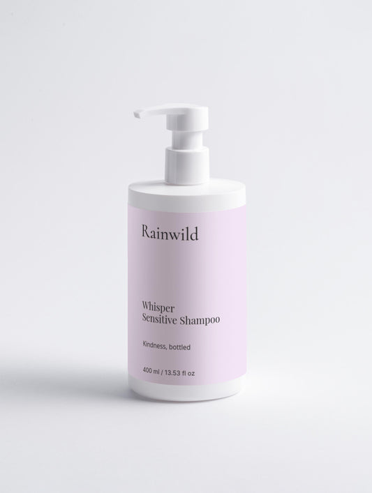 Rainwild Whisper Sensitive Shampoo bottle on a light gray background